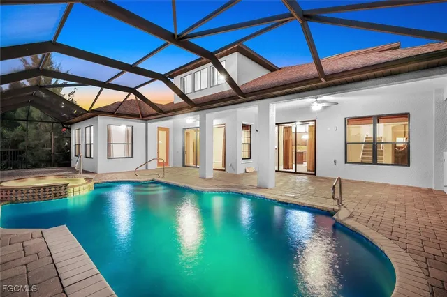 a view of pool with outdoor seating