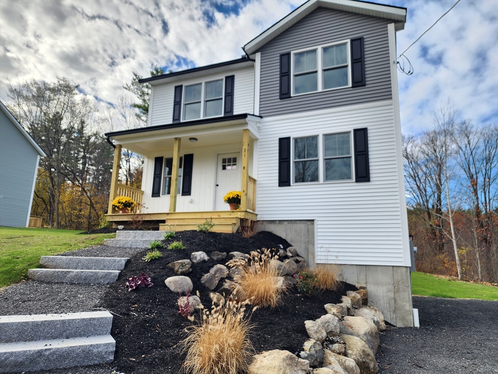 21 Cottage Street Winchendon, MA 01475 - Photo 1 of 12 a front view of a house with garden