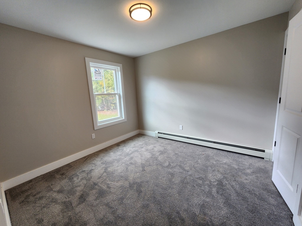 21 Cottage Street Winchendon, MA 01475 - Photo 6 of 12 an empty room with windows
