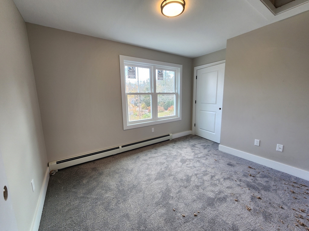 21 Cottage Street Winchendon, MA 01475 - Photo 7 of 12 an empty room with windows