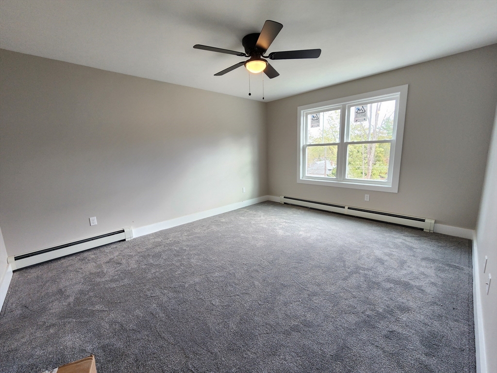 21 Cottage Street Winchendon, MA 01475 - Photo 8 of 12 a view of an empty room with a window