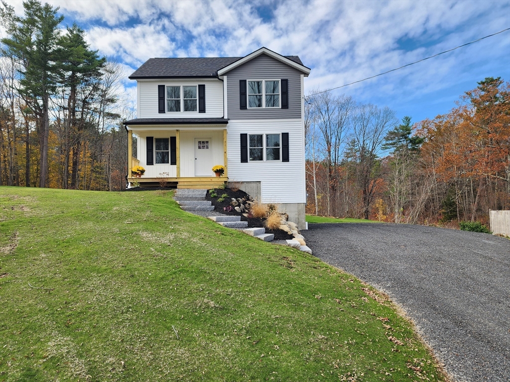 21 Cottage Street Winchendon, MA 01475 - Photo 9 of 12 a front view of a house with a garden and yard