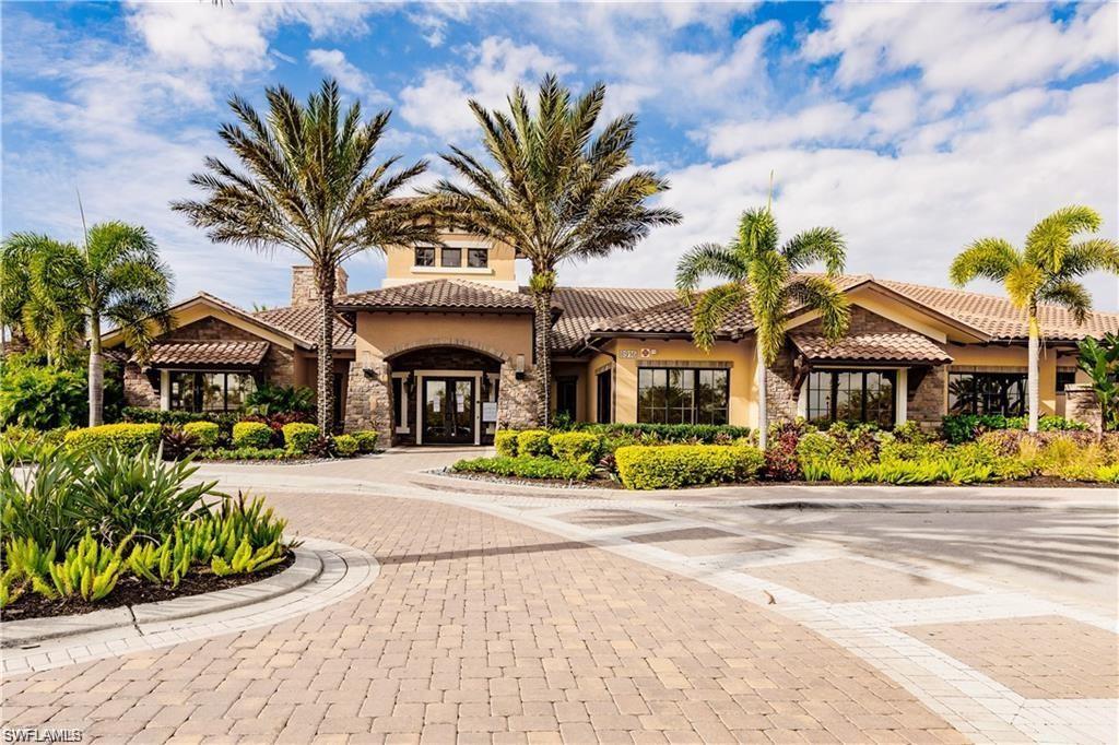 9377 Pocida Court, Unit 202 Naples, FL 34119 - Photo 11 of 30 a front view of multiple houses with yard