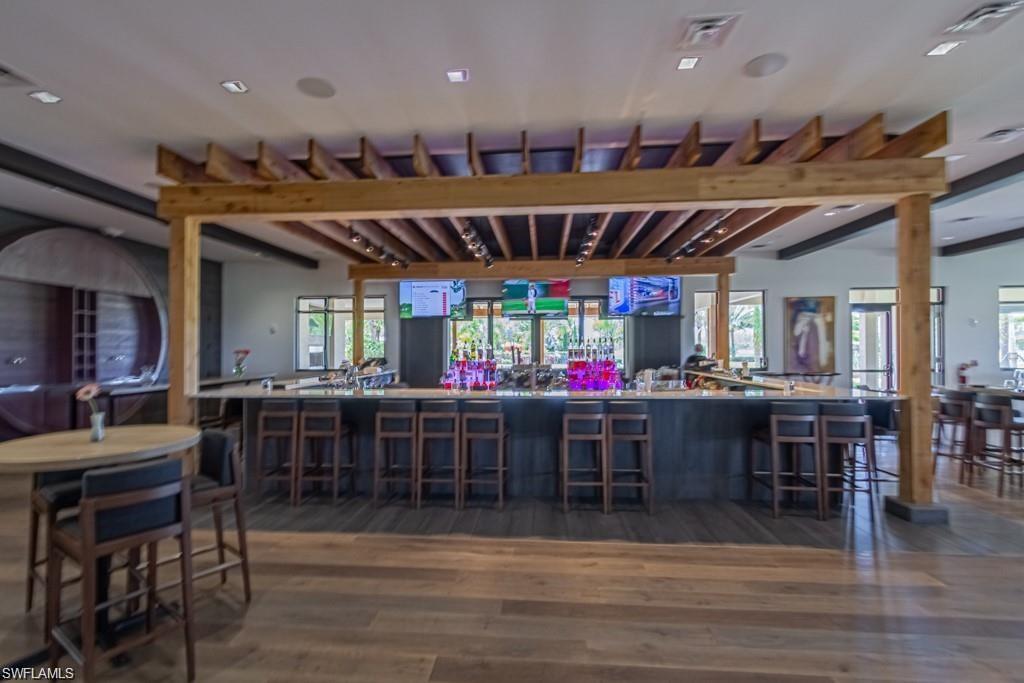 9377 Pocida Court, Unit 202 Naples, FL 34119 - Photo 14 of 30 a view of a bar kitchen
