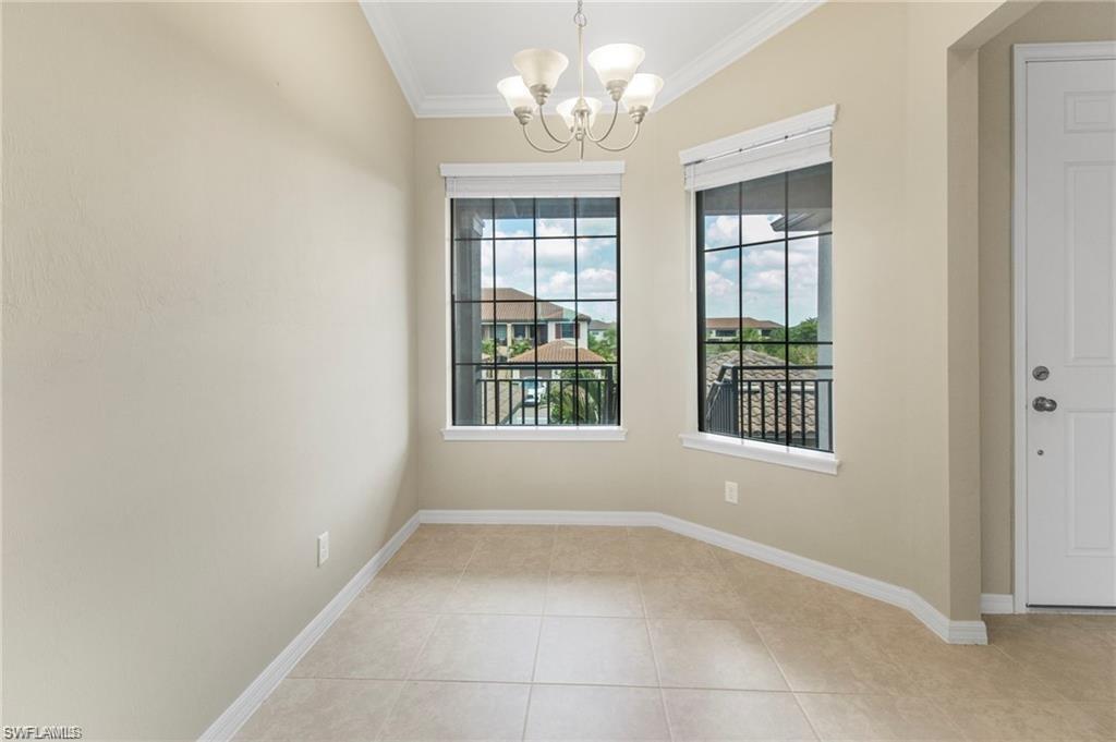9377 Pocida Court, Unit 202 Naples, FL 34119 - Photo 7 of 30 a view of an empty room with a window