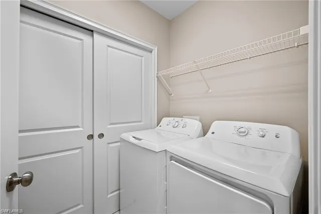 a utility room with dryer and washer