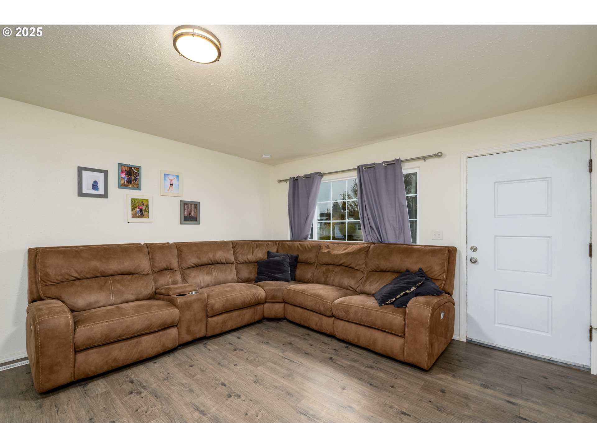 929 East 4th Avenue Riddle, OR 97469 - Photo 9 of 11 a living room with furniture and a window
