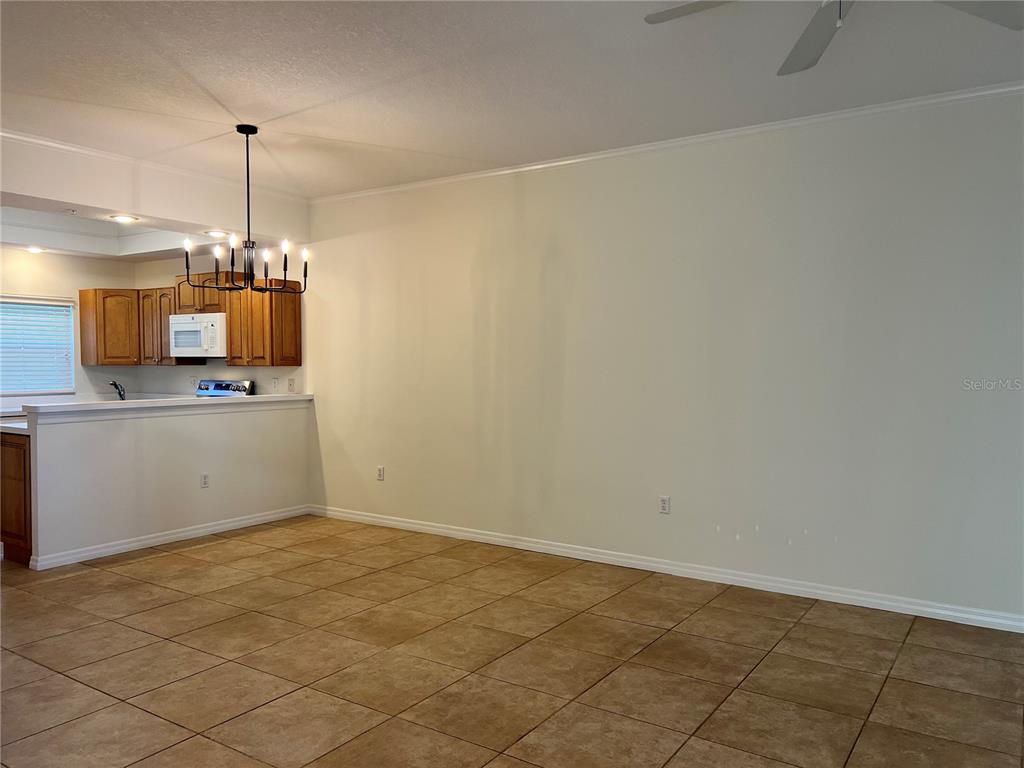 8370 Wingate Drive, Unit 718 Sarasota, FL 34238 - Photo 16 of 49 a view of a kitchen with a sink cabinets and a window