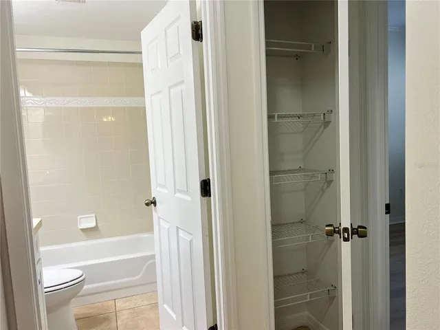 a bathroom with a shower a bathtub and a shower
