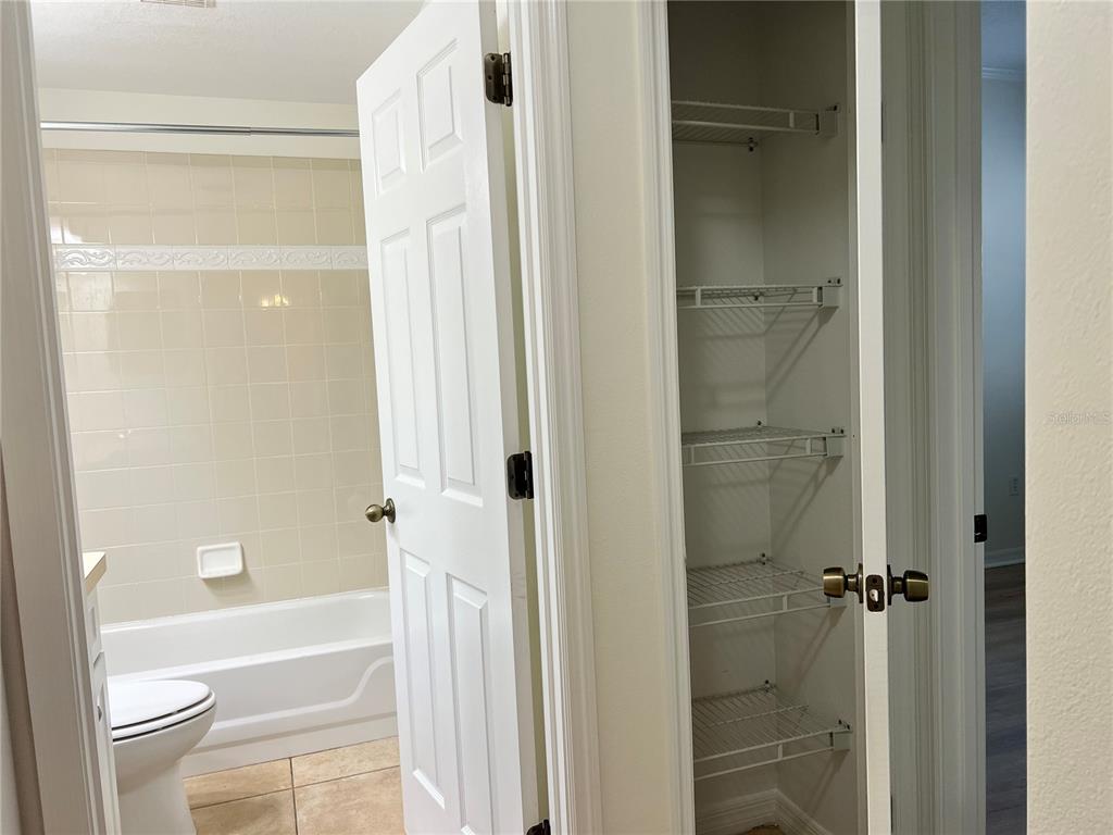 8370 Wingate Drive, Unit 718 Sarasota, FL 34238 - Photo 19 of 49 a bathroom with a shower a bathtub and a shower