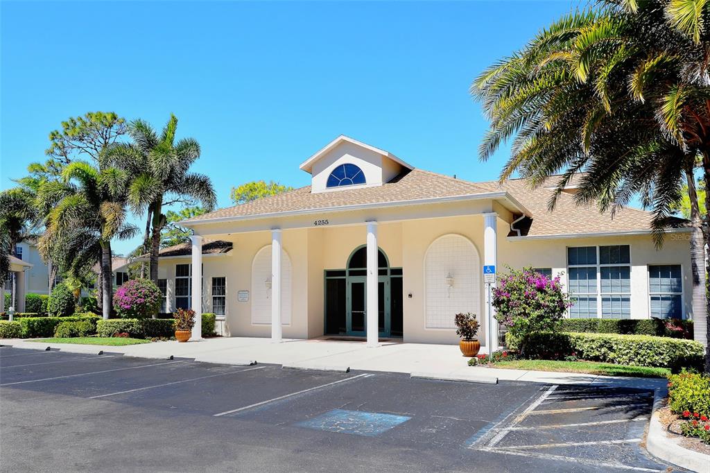 8370 Wingate Drive, Unit 718 Sarasota, FL 34238 - Photo 26 of 49 a front view of a house with a garden