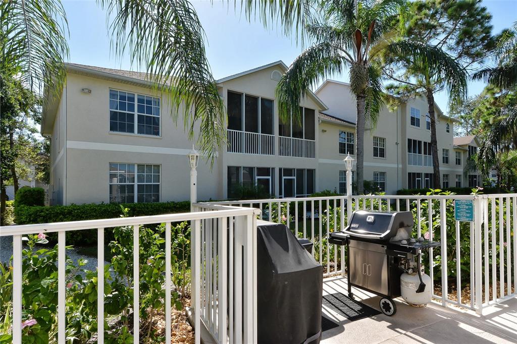 8370 Wingate Drive, Unit 718 Sarasota, FL 34238 - Photo 36 of 49 a view of a house with a patio