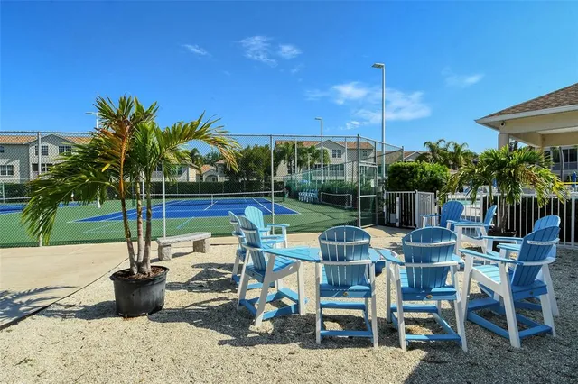 a view of a patio with a table and chairs
