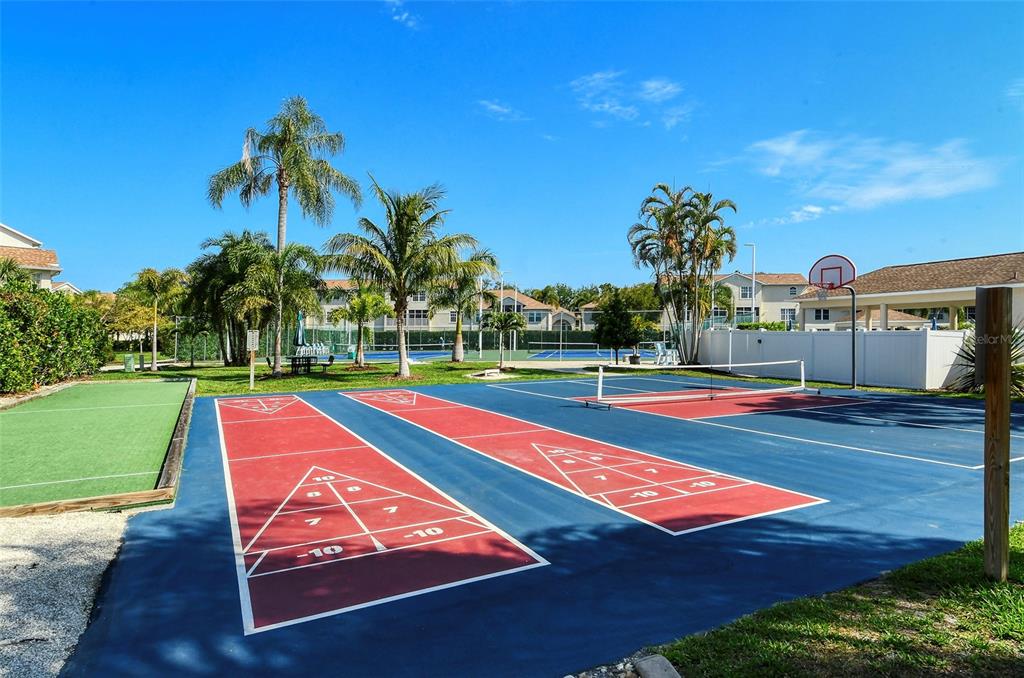 8370 Wingate Drive, Unit 718 Sarasota, FL 34238 - Photo 45 of 49 a view of a tennis court
