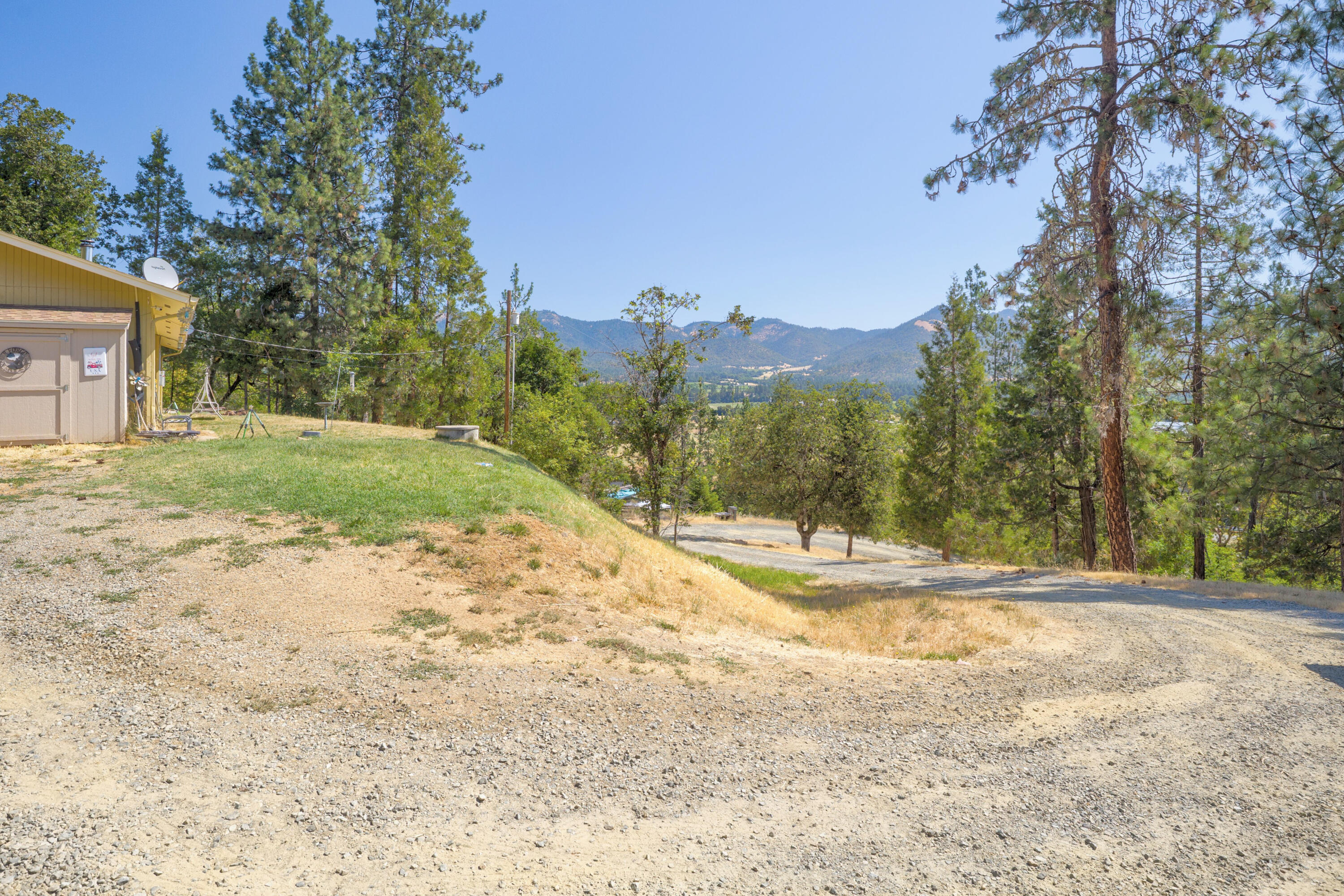 12748 Water Gap Road Williams, OR 97544 - Photo 32 of 35 a view of a yard with large trees
