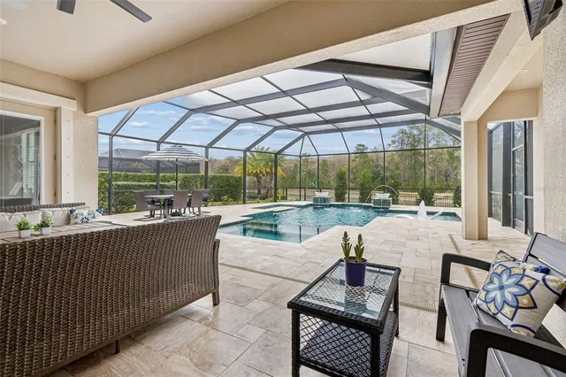 an aerial view of a house with a yard and trees