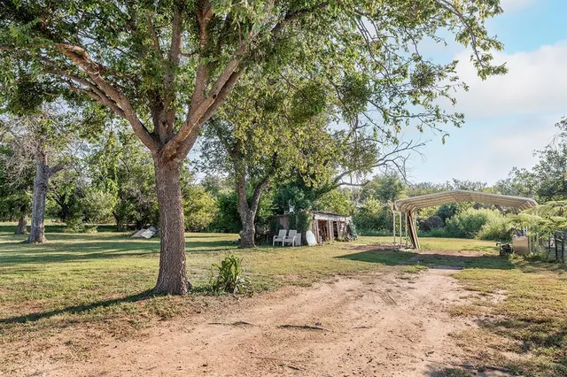 a backyard of a house with lots of green space