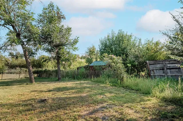 a backyard of a house with lots of green space