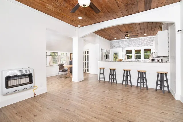 a view of livingroom with furniture wooden floor and windows