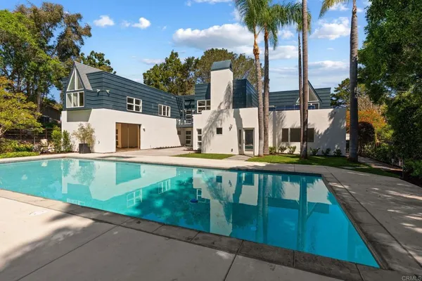 a view of swimming pool with a yard