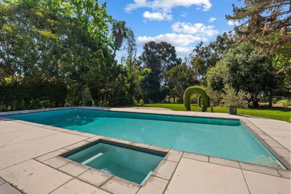 a view of swimming pool with a garden