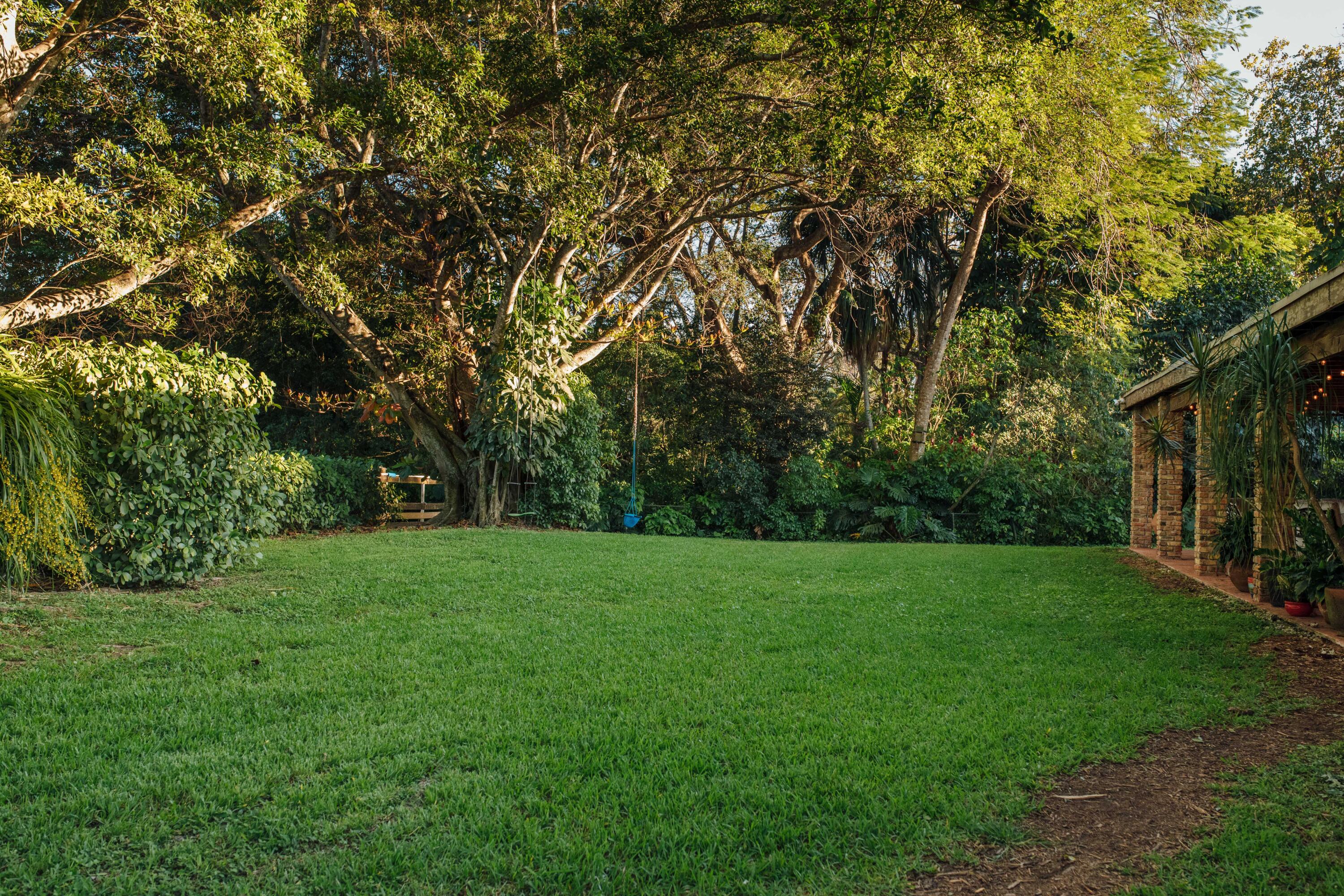 12301 Southwest 107th Avenue Miami, FL 33176 - Photo 11 of 58 a view of a grassy field with trees