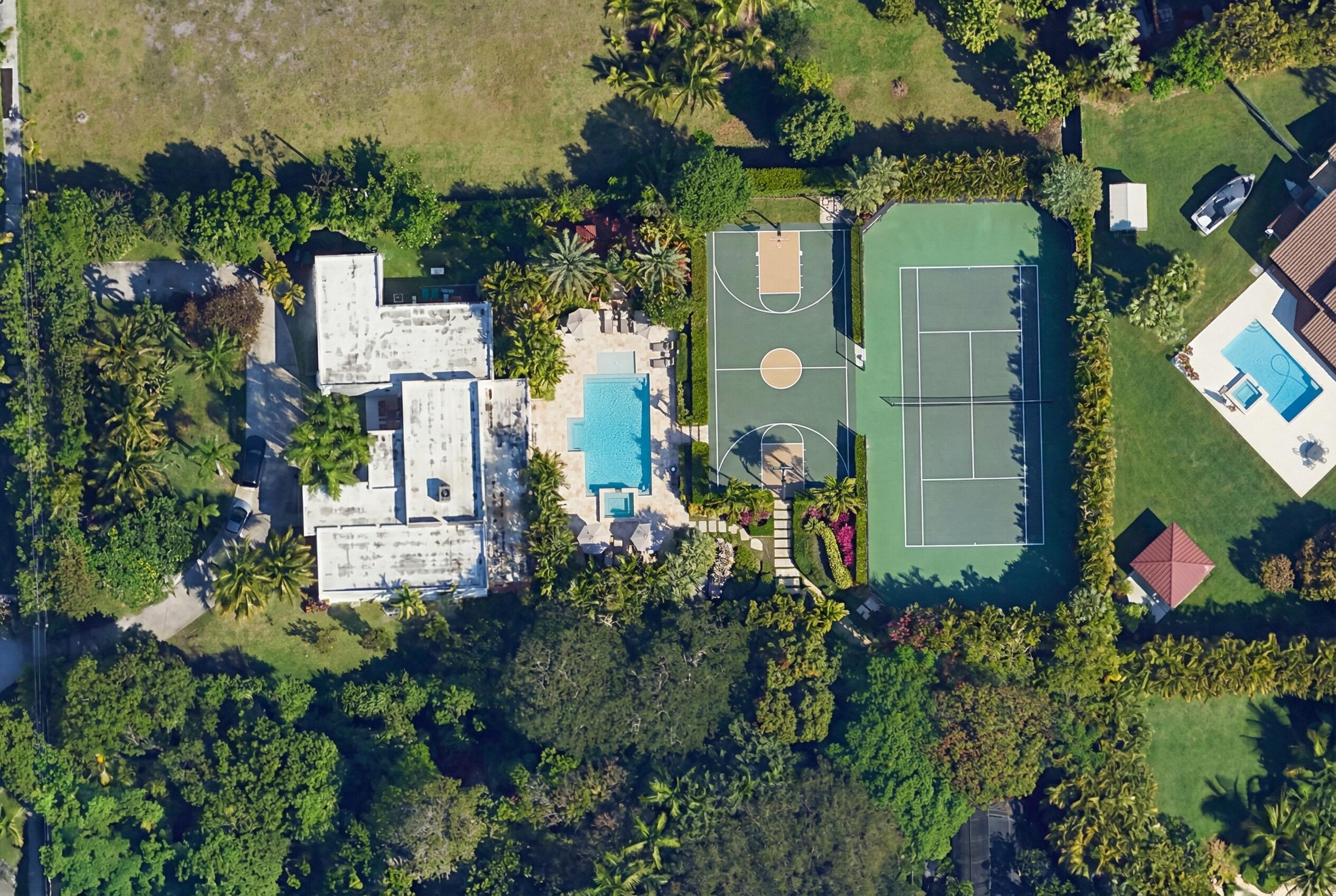 12301 Southwest 107th Avenue Miami, FL 33176 - Photo 14 of 58 an aerial view of residential house with outdoor space and trees all around