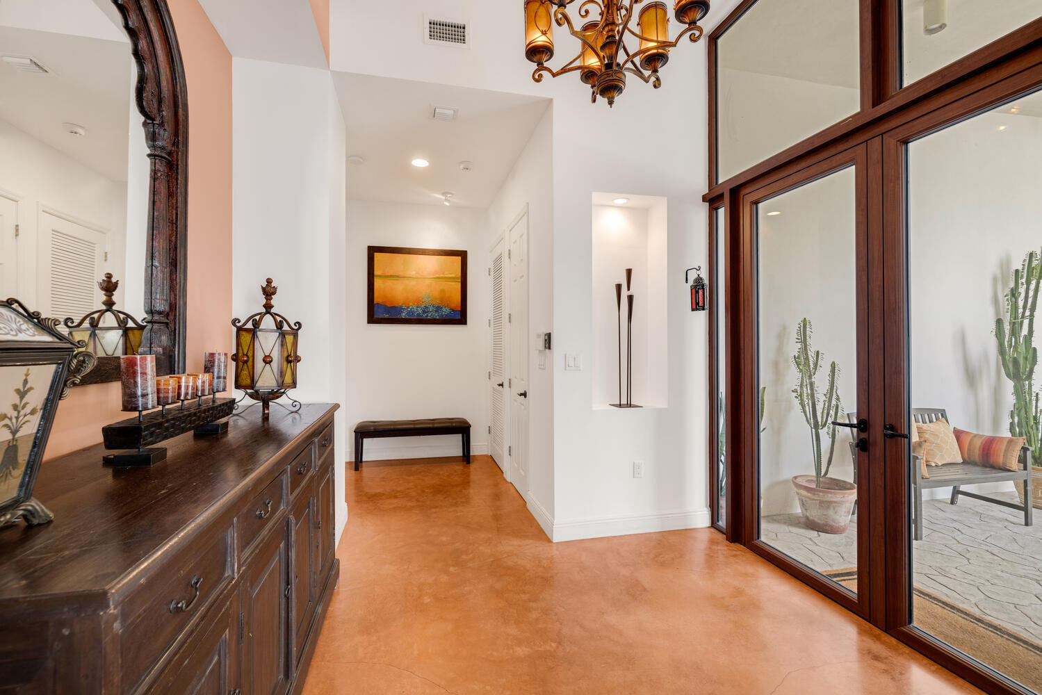 12301 Southwest 107th Avenue Miami, FL 33176 - Photo 17 of 58 a hallway with a large window and a flat screen tv