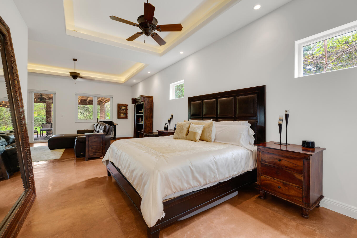 12301 Southwest 107th Avenue Miami, FL 33176 - Photo 25 of 58 a large bedroom with a bed and a chandelier