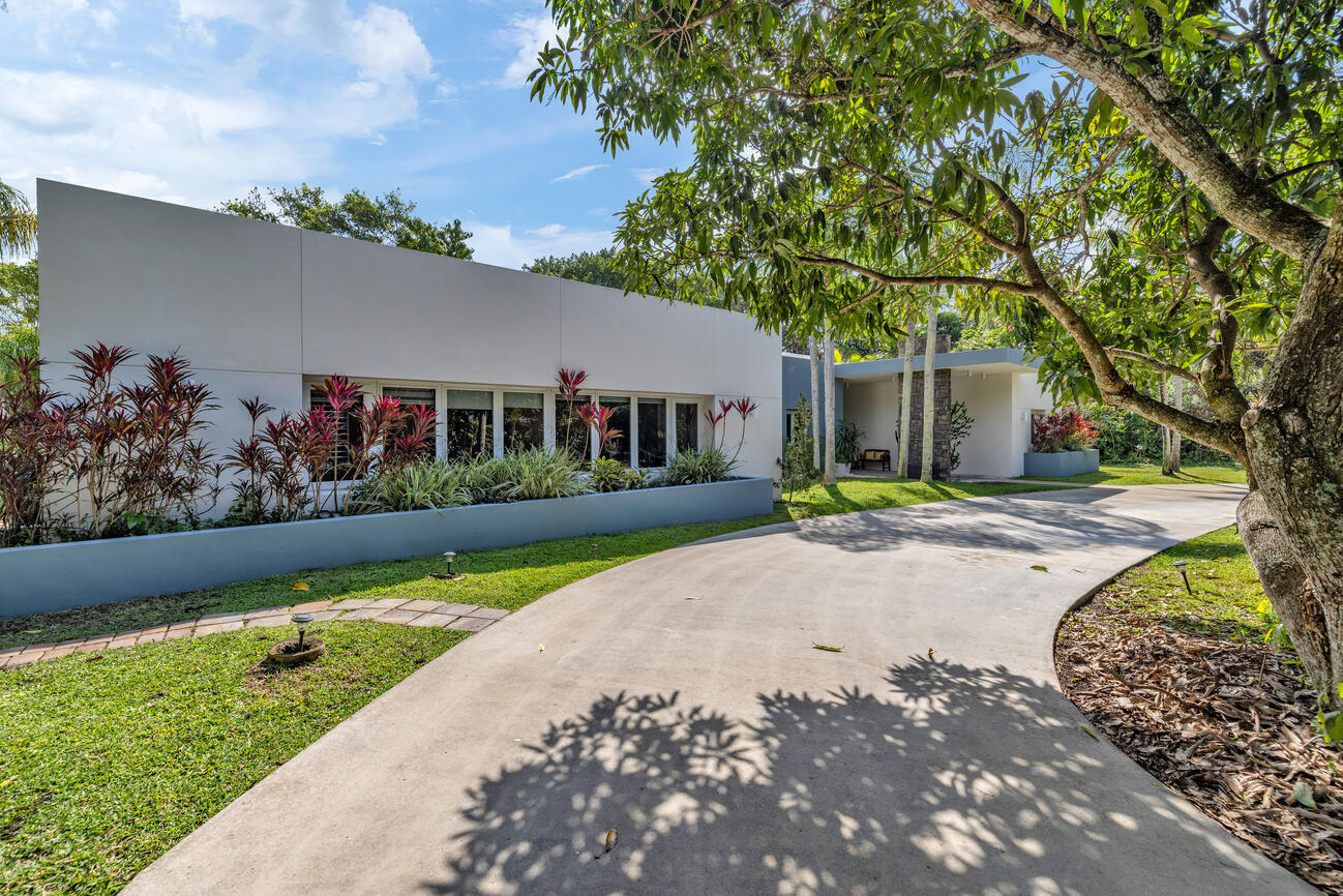 12301 Southwest 107th Avenue Miami, FL 33176 - Photo 3 of 58 a view of a house with a yard and tree s
