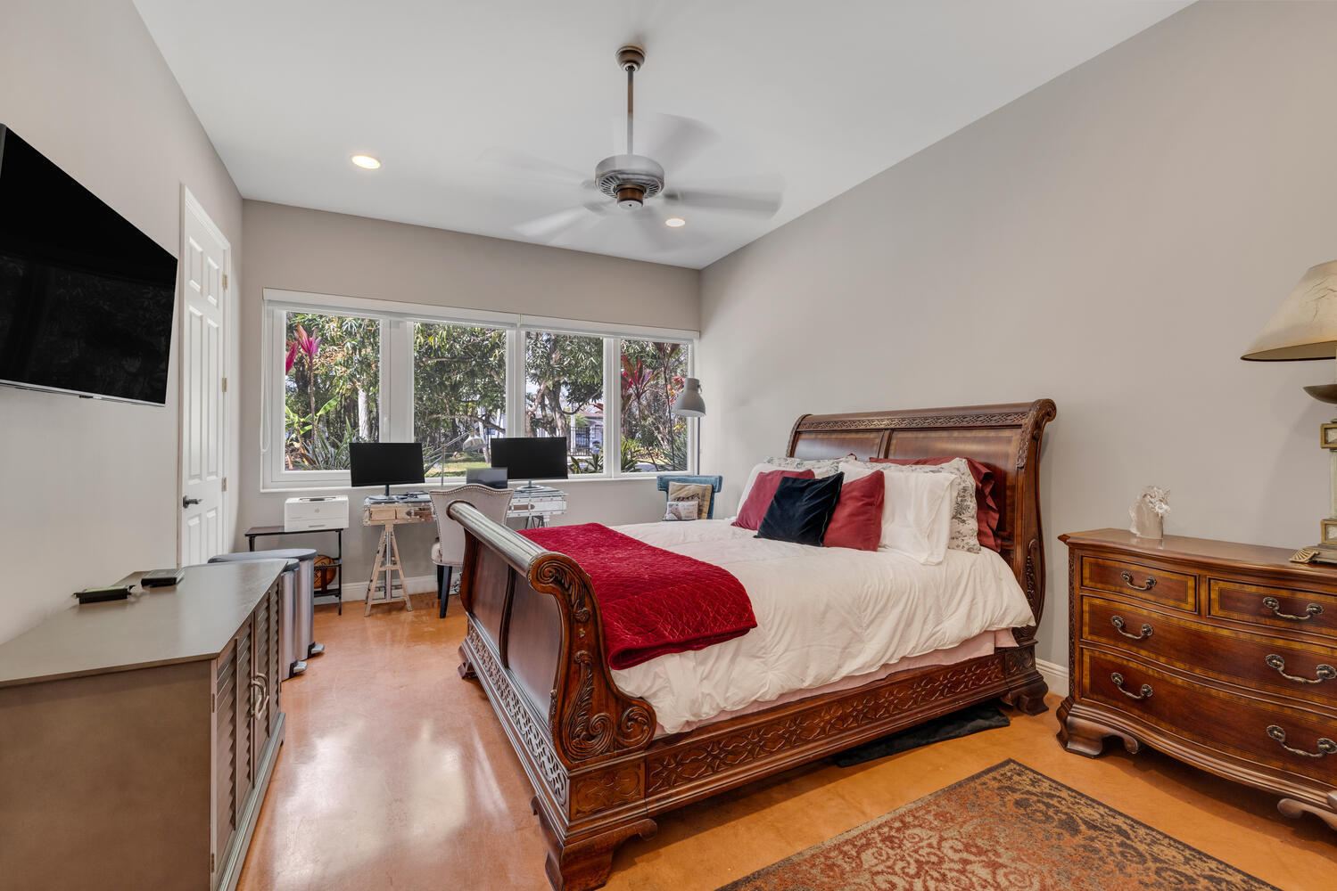 12301 Southwest 107th Avenue Miami, FL 33176 - Photo 34 of 58 a bedroom with a bed a flat screen tv and a couch