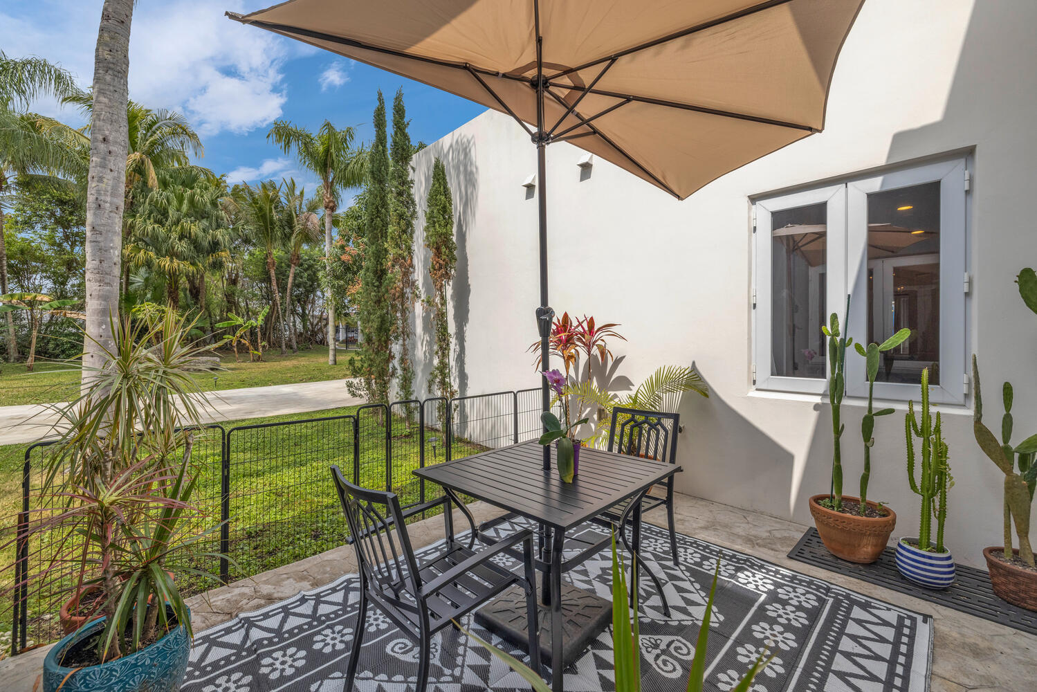 12301 Southwest 107th Avenue Miami, FL 33176 - Photo 39 of 58 a view of an outdoor dining space with a table and chairs