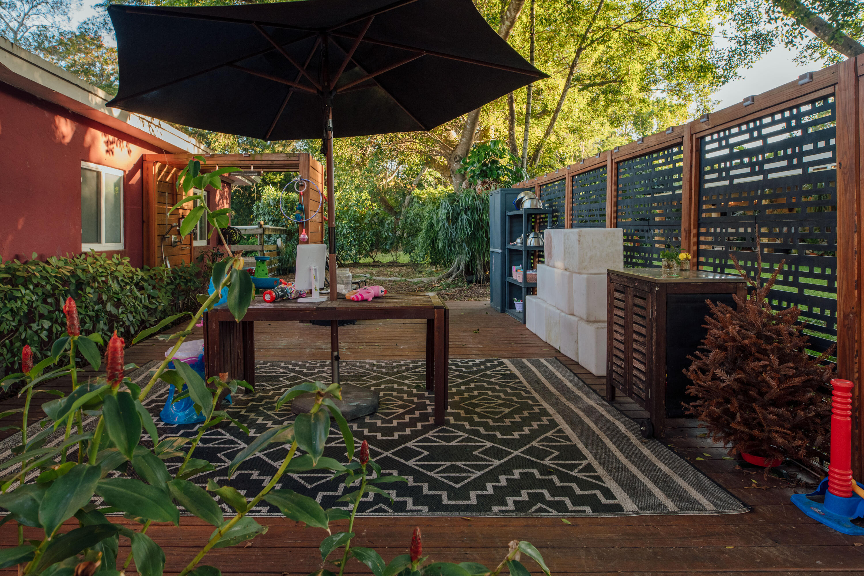 12301 Southwest 107th Avenue Miami, FL 33176 - Photo 46 of 58 a patio with table and chairs and potted plants