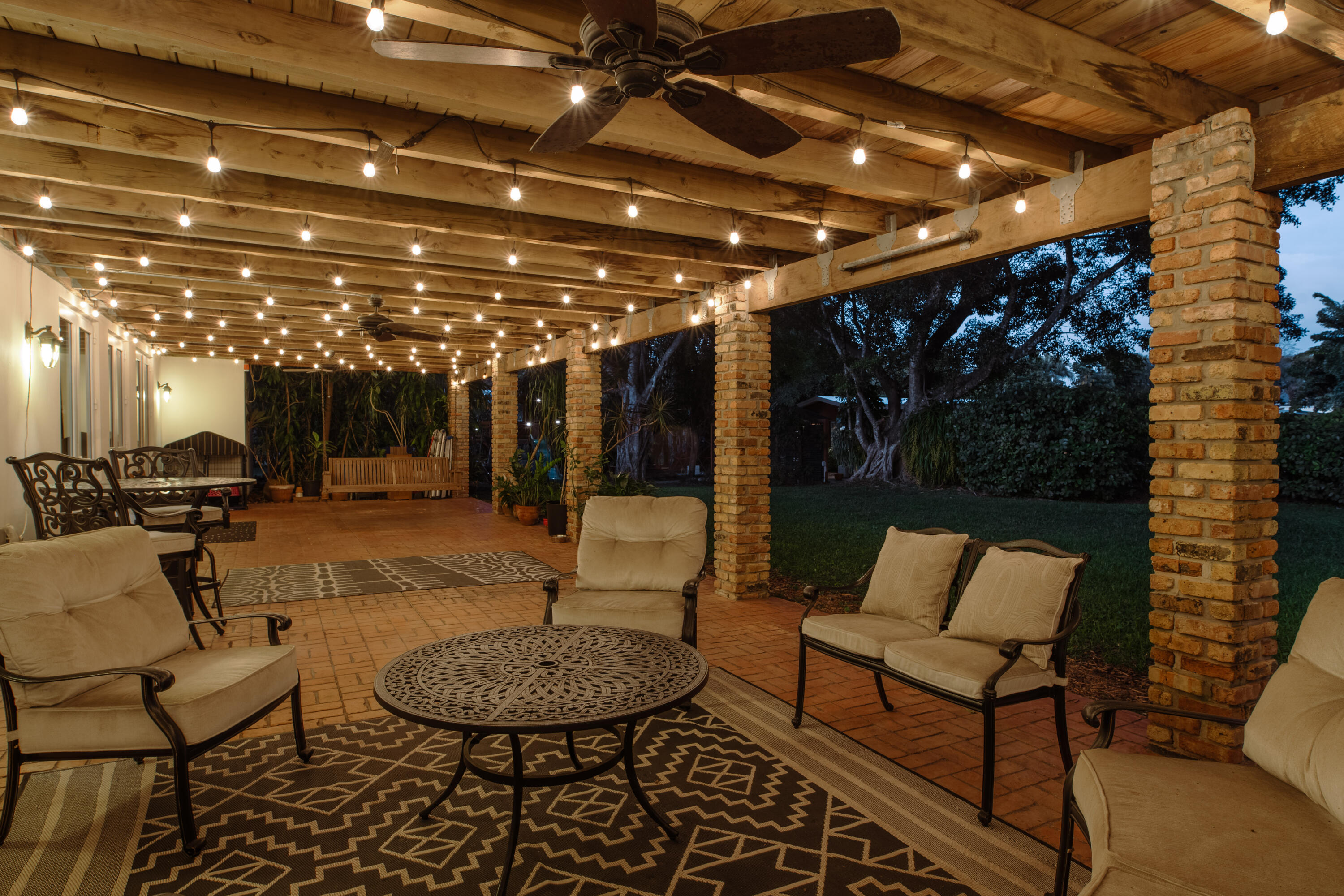 12301 Southwest 107th Avenue Miami, FL 33176 - Photo 8 of 58 a building outdoor space with patio furniture and potted plants