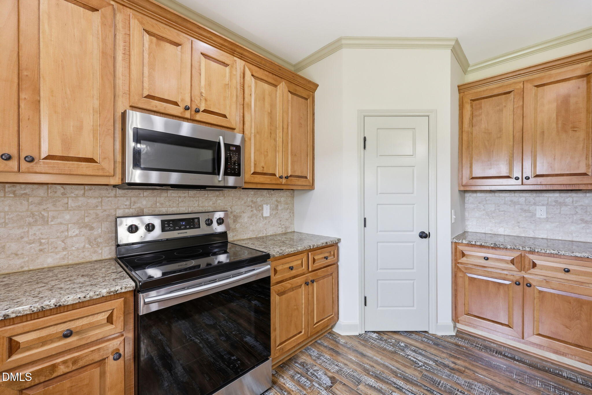 3587 Hannah Creek Road Benson, NC 27504 - Photo 12 of 43 a kitchen with stainless steel appliances granite countertop a stove microwave and sink
