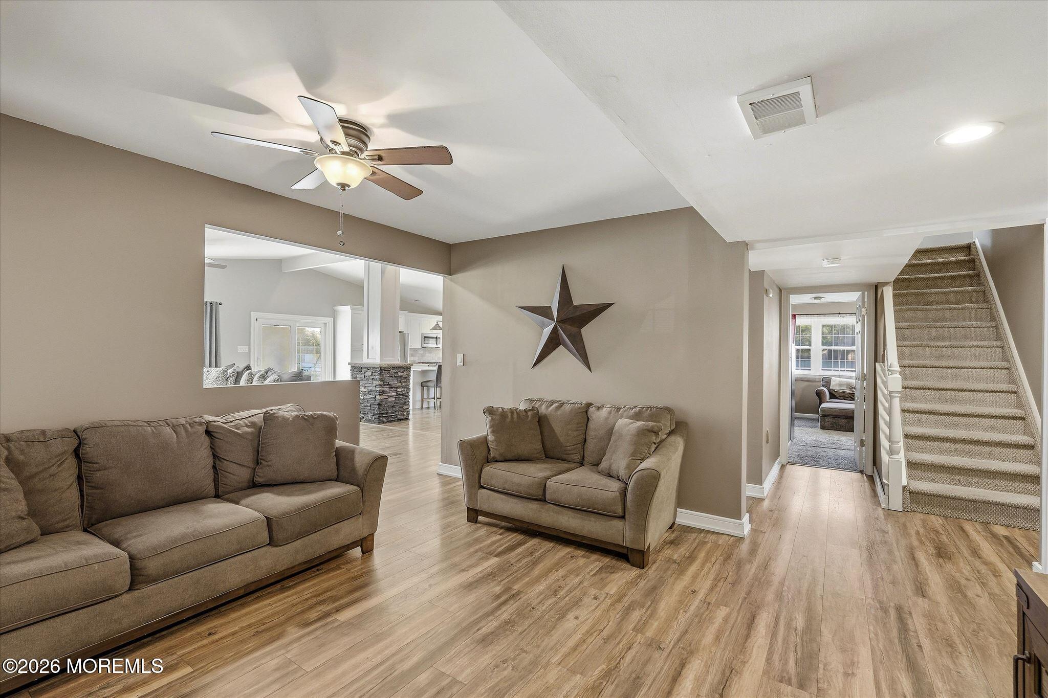 22 Ethan Allen Road Freehold, NJ 07728 - Photo 16 of 31 a living room with furniture and a wooden floor