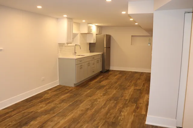 a bathroom with a sink a mirror and a shower