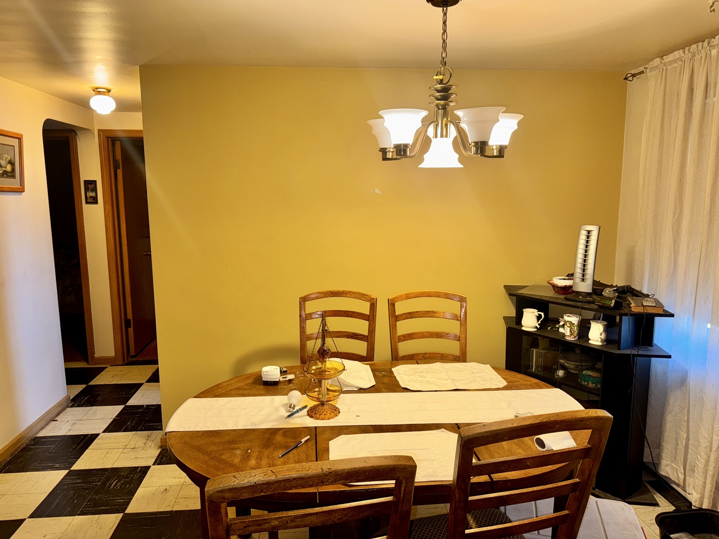 7325 South Kingston Avenue, Unit 2 Chicago, IL 60649 - Photo 7 of 13 a dining room with a table chairs and a chandelier