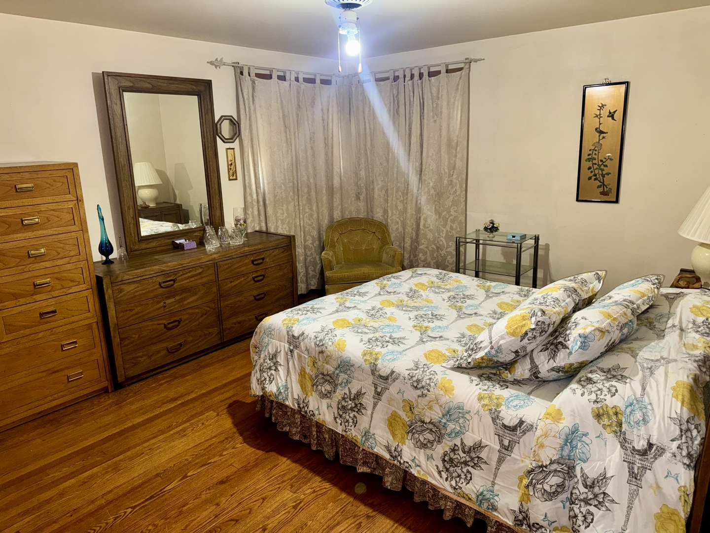 7325 South Kingston Avenue, Unit 2 Chicago, IL 60649 - Photo 8 of 13 a bedroom with a bed and a dresser