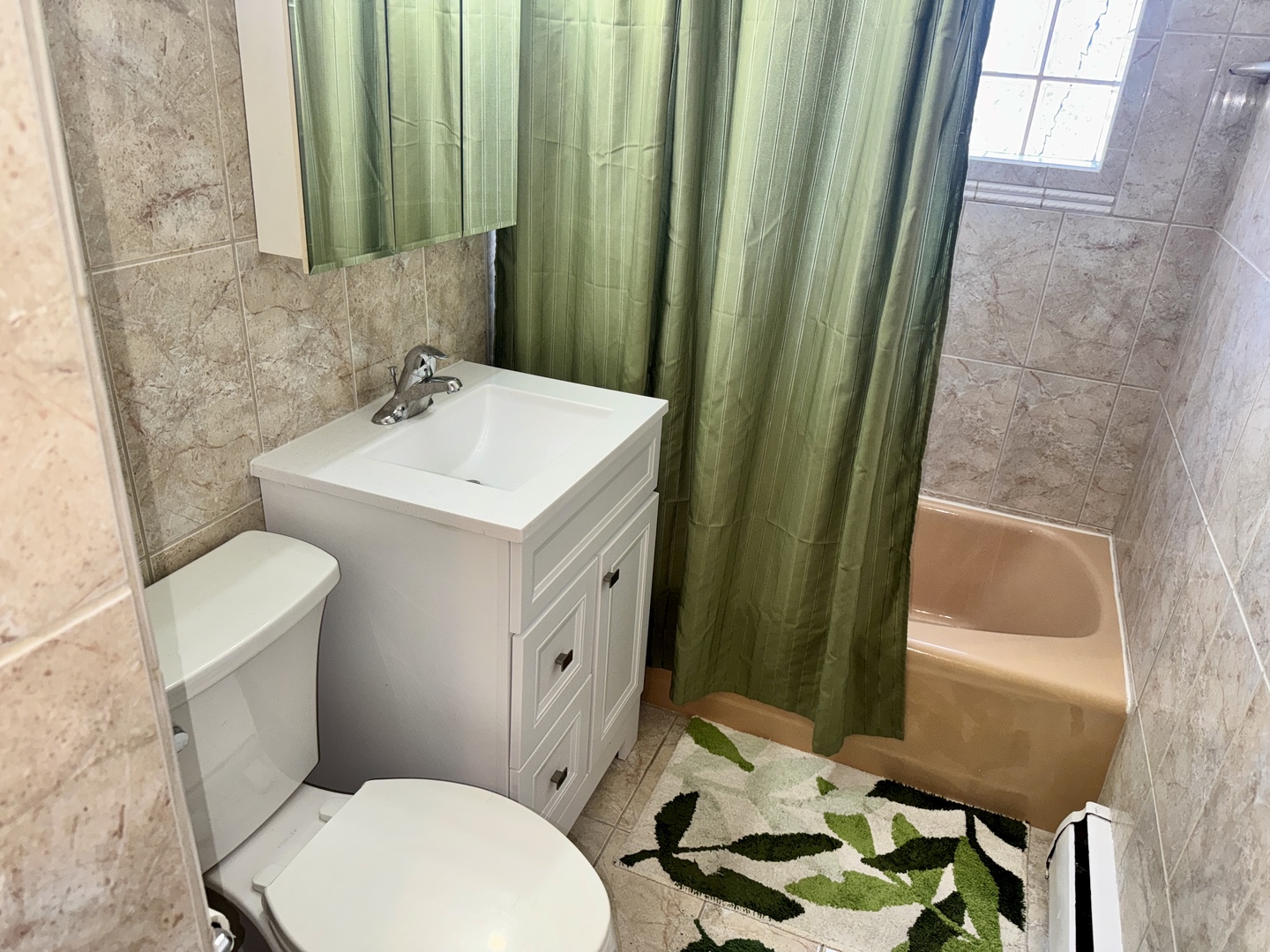 7325 South Kingston Avenue, Unit 2 Chicago, IL 60649 - Photo 9 of 13 a bathroom with a toilet a sink and a mirror