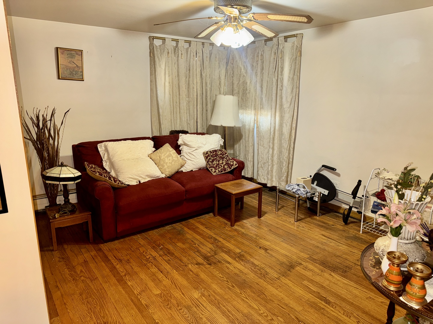 7325 South Kingston Avenue, Unit 2 Chicago, IL 60649 - Photo 10 of 13 a living room with furniture and a chandelier