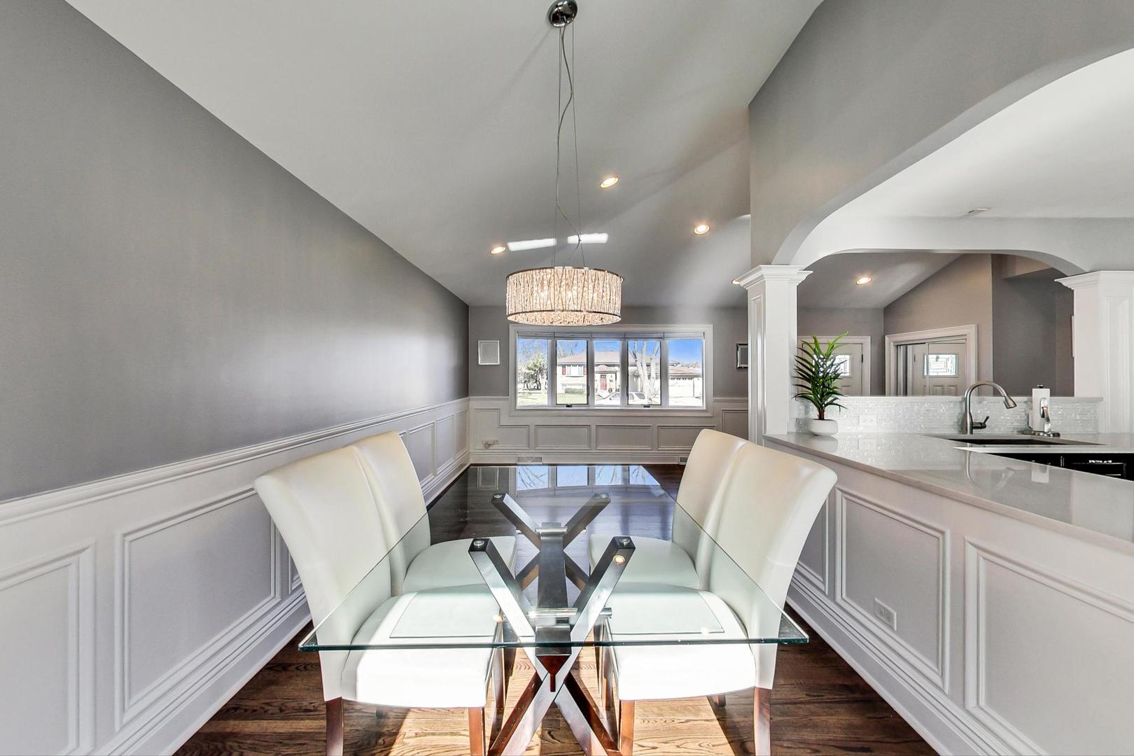 1579 West Holtz Avenue Addison, IL 60101 - Photo 11 of 43 a view of a dining room with furniture and wooden floor