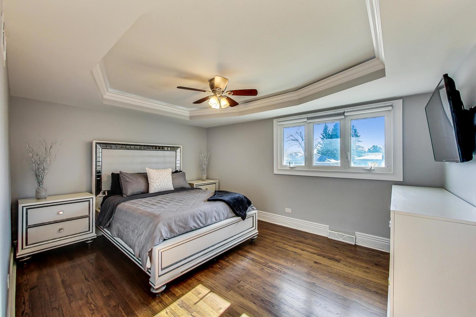 1579 West Holtz Avenue Addison, IL 60101 - Photo 16 of 43 a bedroom with a bed and a window