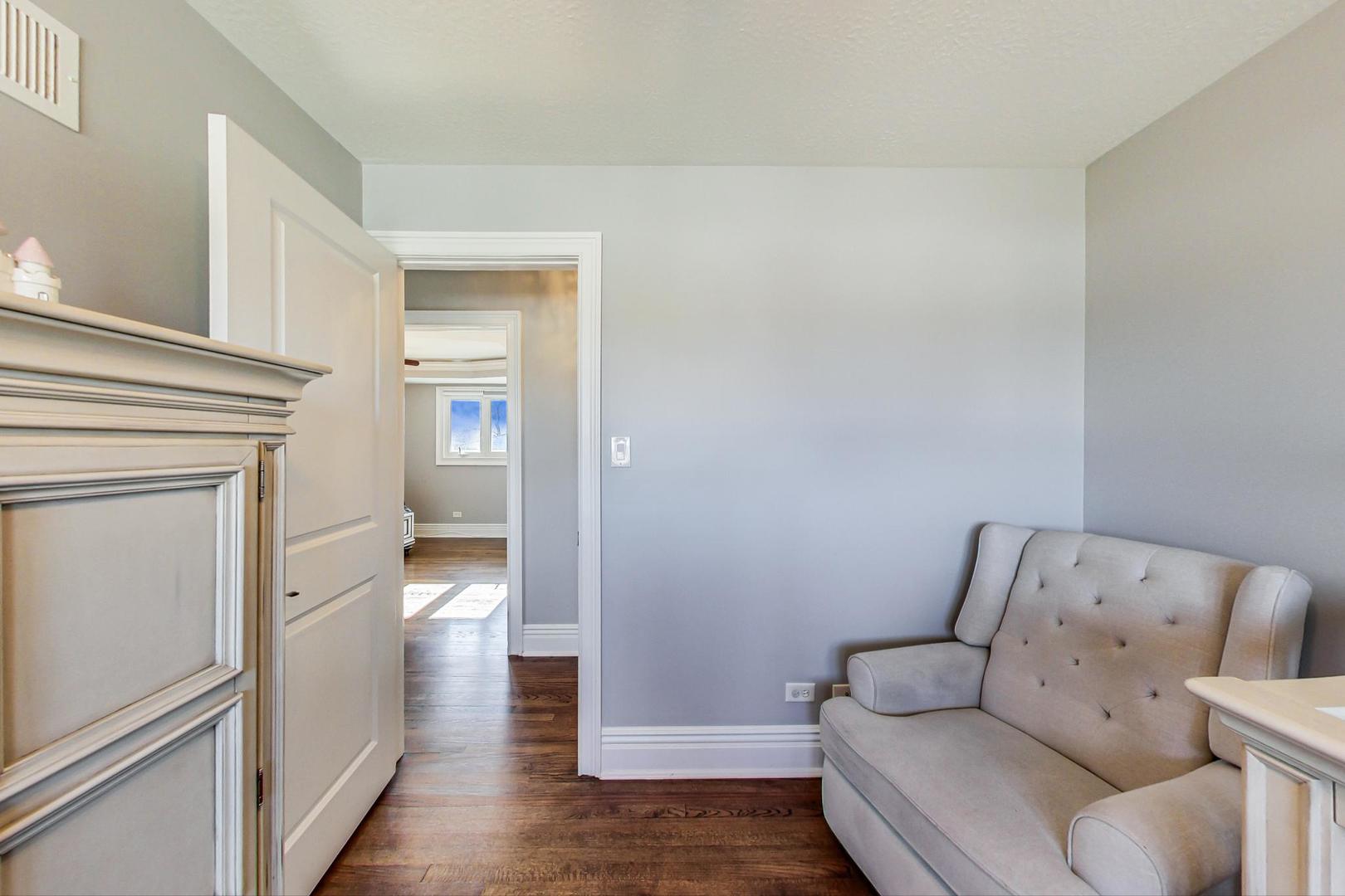1579 West Holtz Avenue Addison, IL 60101 - Photo 25 of 43 a living room with furniture and a wooden floor