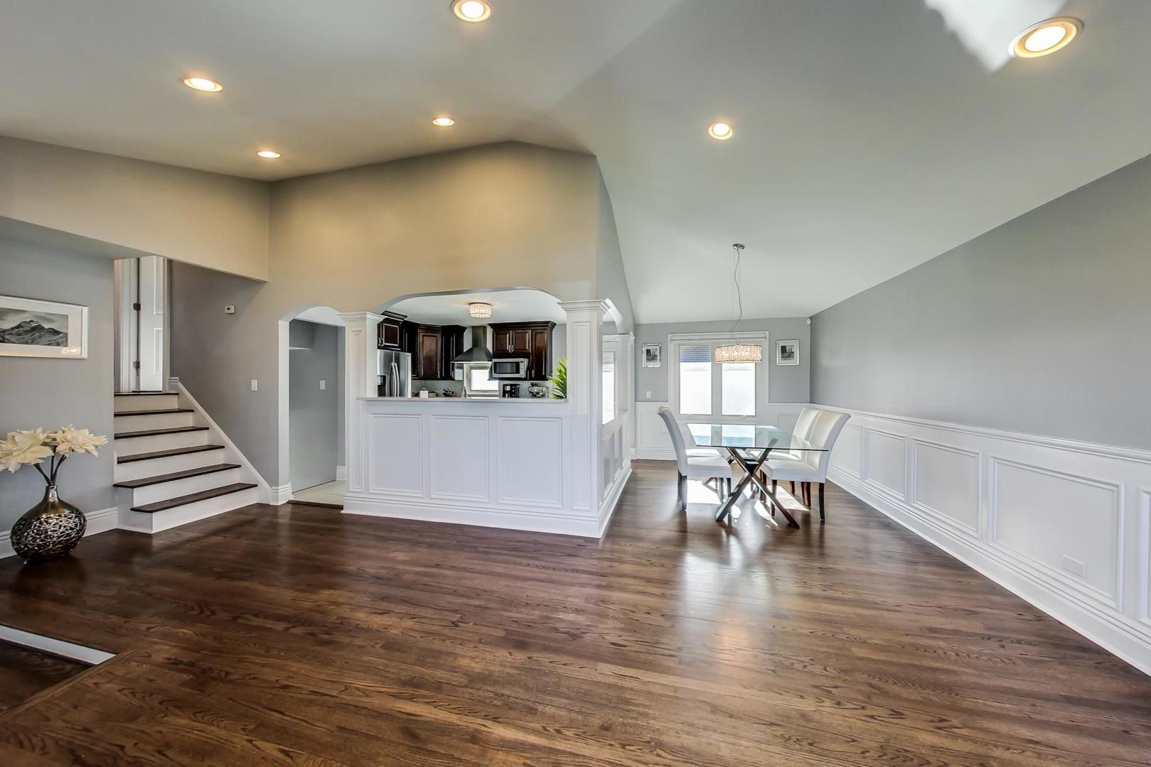1579 West Holtz Avenue Addison, IL 60101 - Photo 9 of 43 a view of a dining room with furniture and wooden floor