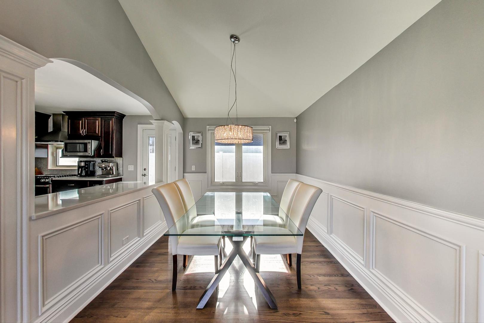 1579 West Holtz Avenue Addison, IL 60101 - Photo 10 of 43 a view of a dining room with furniture window and wooden floor