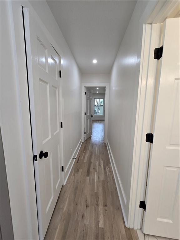 3832 Finger Creek Southwest Lilburn, GA 30047 - Photo 11 of 24 a view of a hallway with wooden floor and staircase