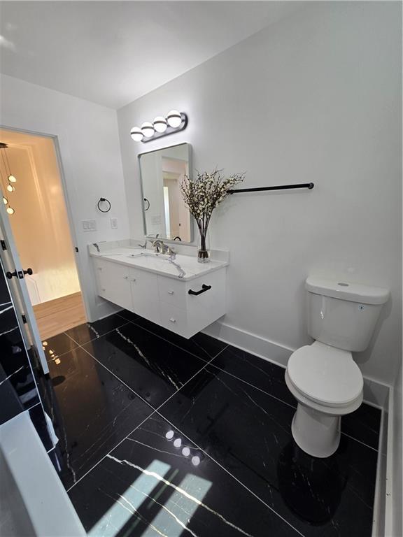 3832 Finger Creek Southwest Lilburn, GA 30047 - Photo 12 of 24 a bathroom with a sink and a mirror