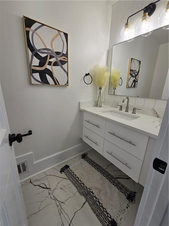 3832 Finger Creek Southwest Lilburn, GA 30047 - Photo 13 of 24 a bathroom with a sink and a mirror