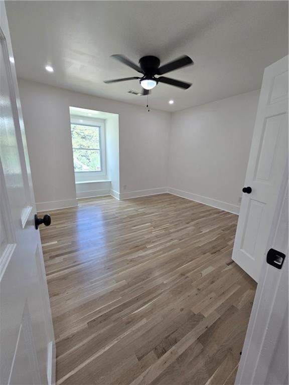 3832 Finger Creek Southwest Lilburn, GA 30047 - Photo 14 of 24 wooden floor in an empty room with a window